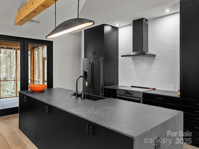 80 Hemlock Cir, Black Mountain, NC 28711 - kitchen featuring dark cabinetry, wall chimney exhaust hood, high end fridge, a sink, and recessed lighting