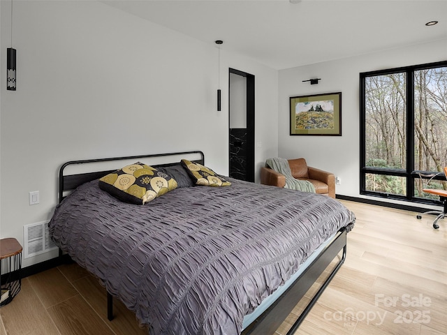 80 Hemlock Cir, Black Mountain, NC 28711 - bedroom featuring wood finished floors and baseboards