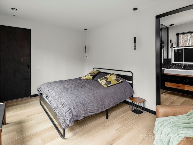 80 Hemlock Cir, Black Mountain, NC 28711 - bedroom featuring light wood-type flooring and baseboards