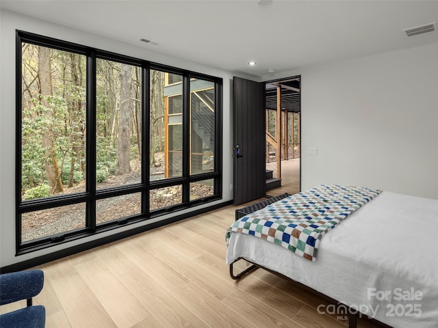 80 Hemlock Cir, Black Mountain, NC 28711 - bedroom featuring access to exterior, wood finished floors, and recessed lighting