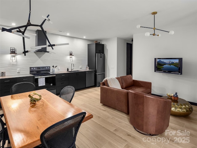 80 Hemlock Cir, Black Mountain, NC 28711 - dining area featuring light wood-style floors, a chandelier, and recessed lighting