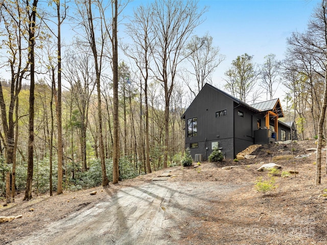 80 Hemlock Cir, Black Mountain, NC 28711 - view of home's exterior featuring metal roof and dirt driveway