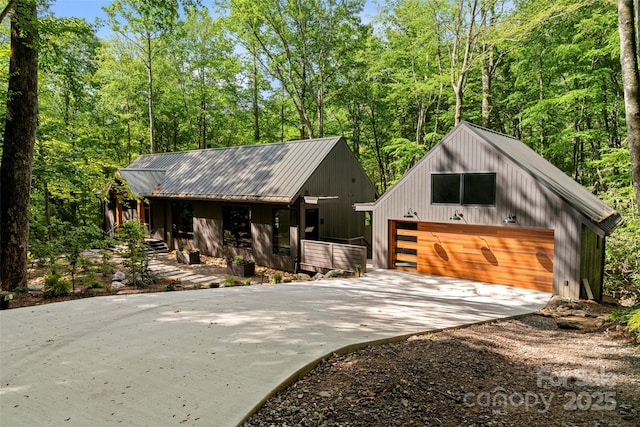 80 Hemlock Cir, Black Mountain, NC 28711 - view of front facade featuring driveway, a detached garage, and metal roof