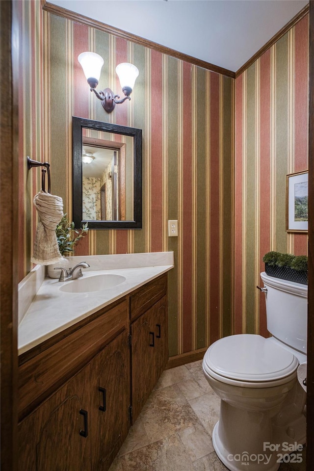 bathroom with an inviting chandelier, vanity, stone finish floor, and toilet