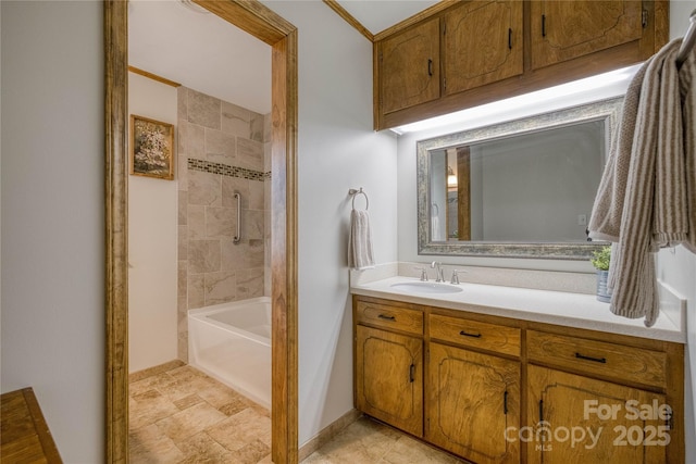 full bath with vanity, baseboards, and shower / tub combination