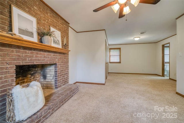 carpeted living area featuring crown molding, baseboards, ceiling fan, and a fireplace