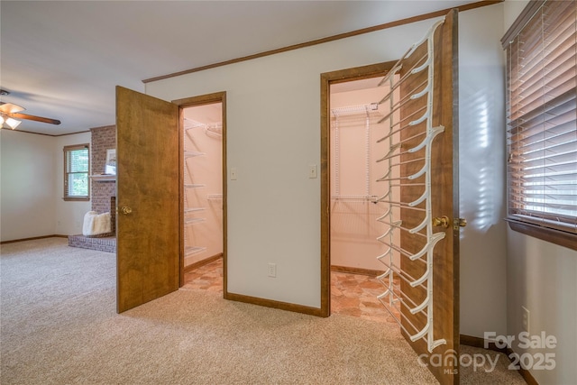 unfurnished bedroom with baseboards, carpet flooring, and ornamental molding