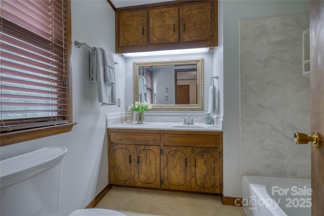 full bath with vanity, baseboards, toilet, and a bathtub