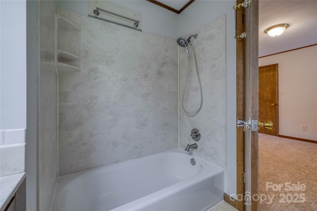 bathroom featuring baseboards, ornamental molding, bathtub / shower combination, and vanity
