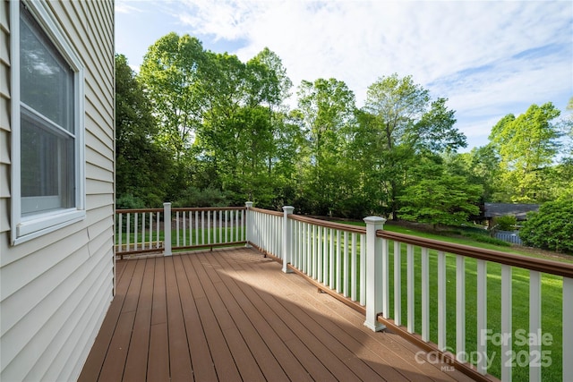 wooden deck with a yard