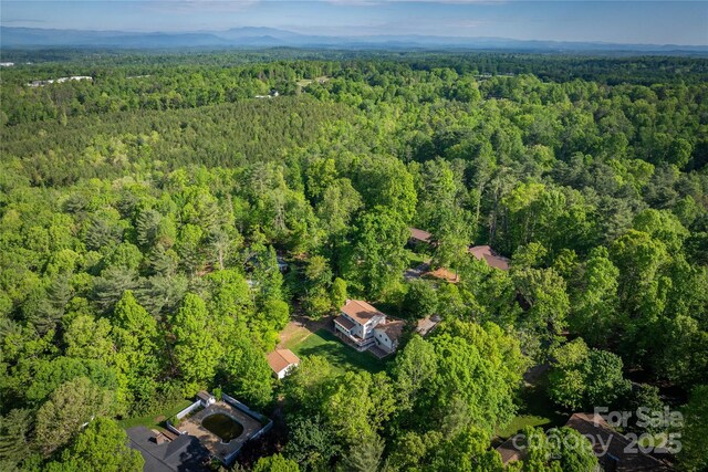 aerial view featuring a forest view