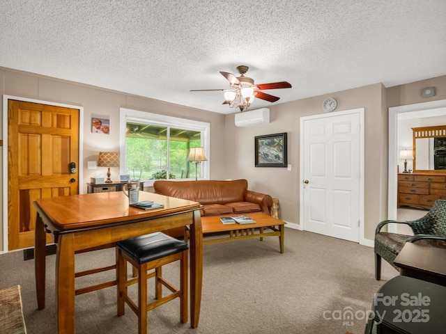 carpeted living area with a wall mounted AC, a ceiling fan, and a textured ceiling