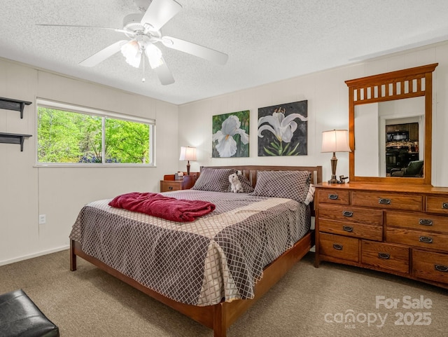carpeted bedroom featuring a textured ceiling and ceiling fan