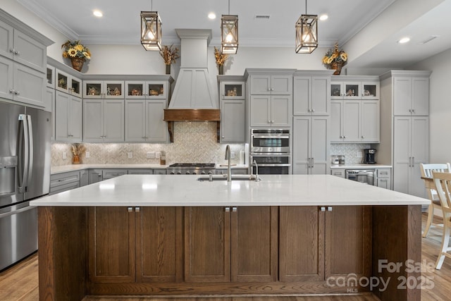 5360 Low Country Rd, Lenoir, NC 28645 - kitchen with appliances with stainless steel finishes, a sink, light countertops, decorative backsplash, and ornamental molding