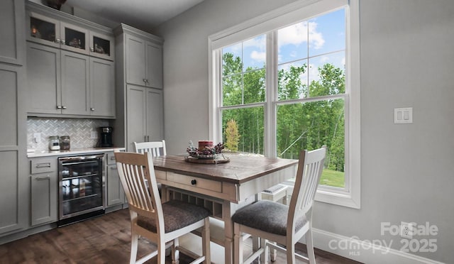 5360 Low Country Rd, Lenoir, NC 28645 - dining space with wine cooler, dark wood-style floors, a dry bar, and baseboards