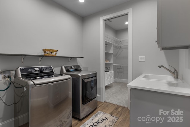 5360 Low Country Rd, Lenoir, NC 28645 - washroom featuring cabinet space, independent washer and dryer, light wood-style floors, and recessed lighting