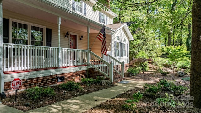 doorway to property with covered porch