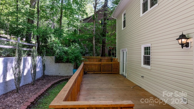 wooden deck featuring fence