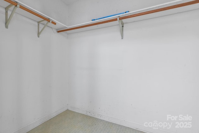 spacious closet featuring tile patterned floors