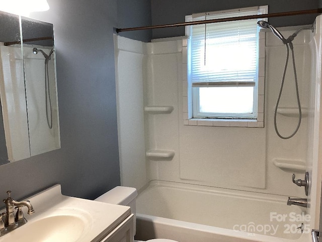 full bathroom featuring vanity, shower / bathing tub combination, and toilet