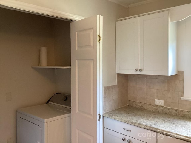 laundry room with laundry area and washer / clothes dryer
