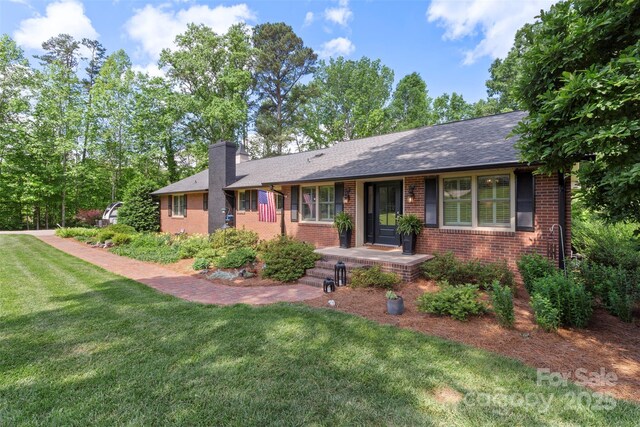 530 Bonita Dr, Landis, NC 28088 - single story home featuring brick siding, a front lawn, a chimney, and a shingled roof