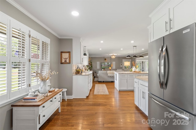 530 Bonita Dr, Landis, NC 28088 - kitchen with freestanding refrigerator, open floor plan, light wood-style flooring, recessed lighting, and white cabinets