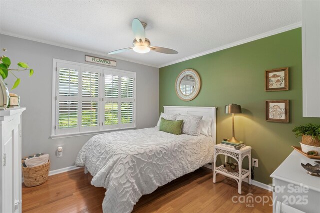 530 Bonita Dr, Landis, NC 28088 - bedroom featuring wood finished floors, crown molding, baseboards, a textured ceiling, and ceiling fan