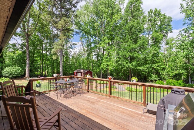 530 Bonita Dr, Landis, NC 28088 - wooden terrace featuring outdoor dining area and view of scattered trees