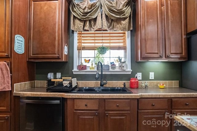 5562 Jenkins Rd, Morganton, NC 28655 - kitchen featuring a sink, dishwashing machine, and brown cabinets