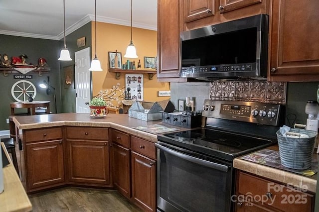 5562 Jenkins Rd, Morganton, NC 28655 - kitchen with stainless steel microwave, a peninsula, crown molding, and range with electric cooktop