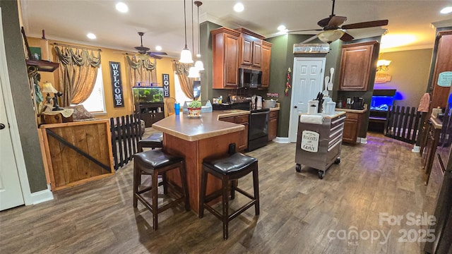 5562 Jenkins Rd, Morganton, NC 28655 - kitchen featuring black electric range oven, crown molding, ceiling fan, and stainless steel microwave