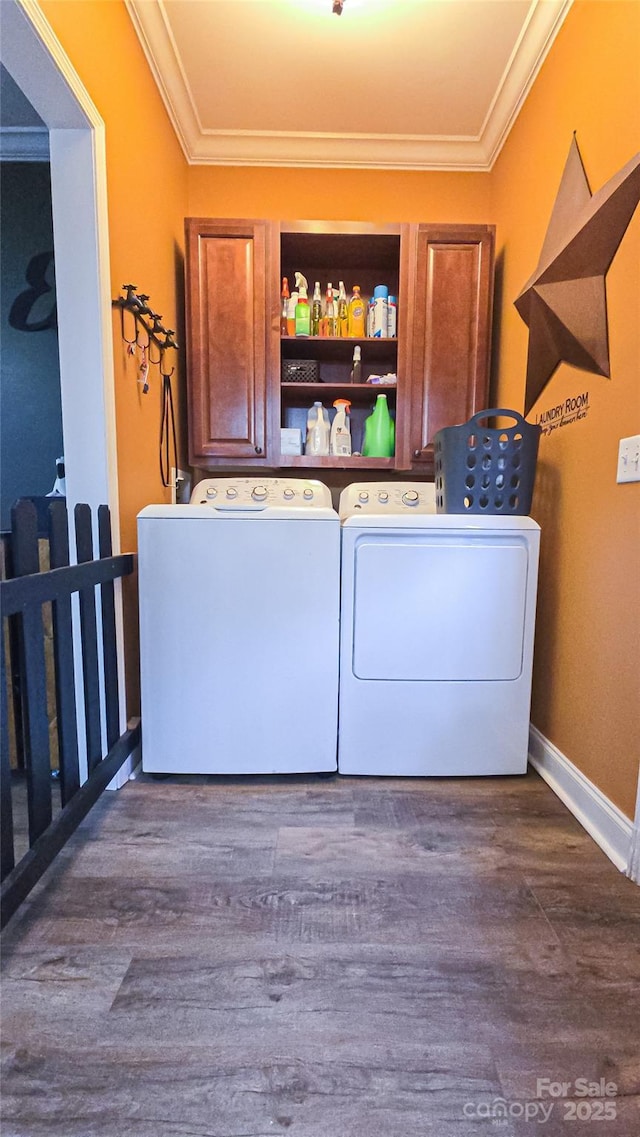5562 Jenkins Rd, Morganton, NC 28655 - washroom with dark wood finished floors, laundry area, crown molding, and washer and clothes dryer