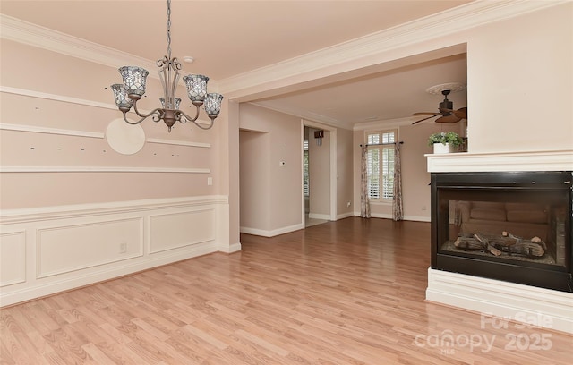 1142 Ardwyck Pl Unit 5, Rock Hill, SC 29730 - unfurnished living room featuring a multi sided fireplace, ornamental molding, light wood-type flooring, a ceiling fan, and a chandelier