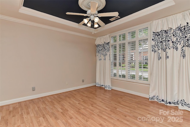 1142 Ardwyck Pl Unit 5, Rock Hill, SC 29730 - spare room with a tray ceiling, ornamental molding, light wood-type flooring, baseboards, and a ceiling fan