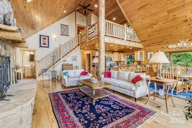 living room with wood ceiling, stairway, high vaulted ceiling, wood-type flooring, and recessed lighting