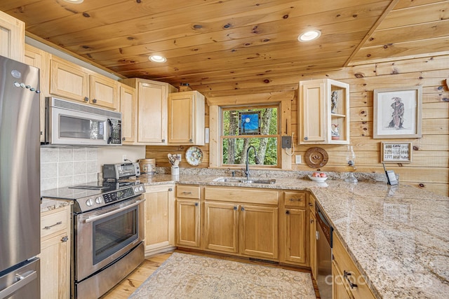 kitchen featuring stainless steel appliances, light stone counters, wooden ceiling, and a sink