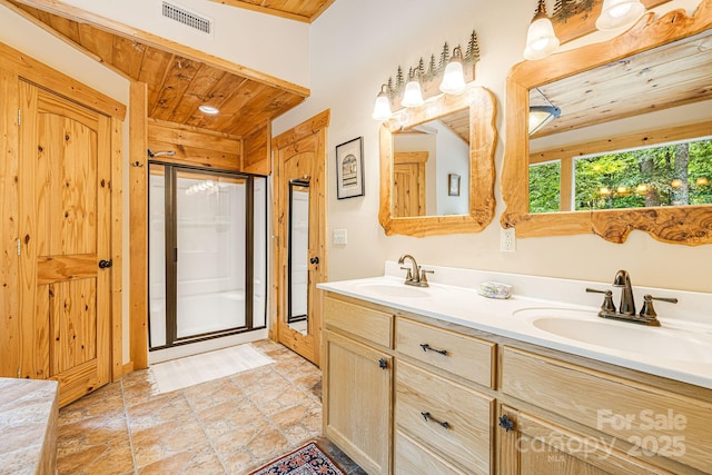 full bathroom with visible vents, a sink, wooden ceiling, and a shower stall