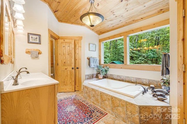 bathroom featuring a sink, double vanity, wooden ceiling, vaulted ceiling, and a bath