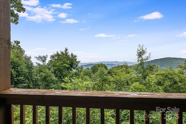view of mountain feature with a view of trees