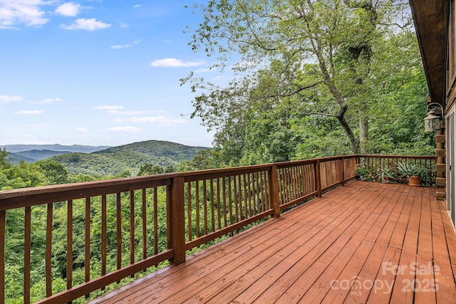 wooden deck with a mountain view