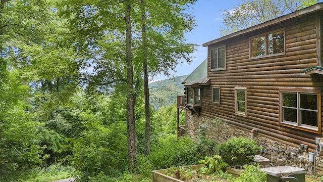 view of home's exterior with a vegetable garden