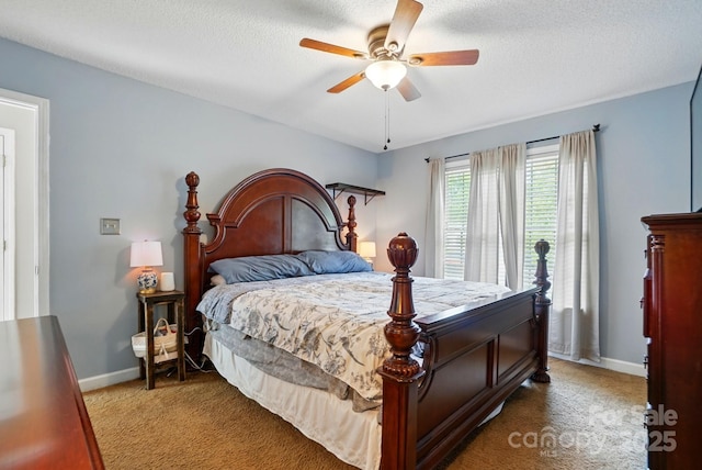 bedroom featuring baseboards, a ceiling fan, carpet flooring, and a textured ceiling