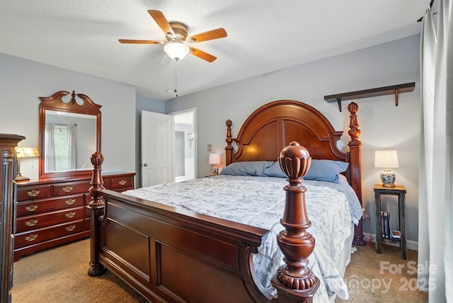 bedroom featuring ceiling fan and light colored carpet
