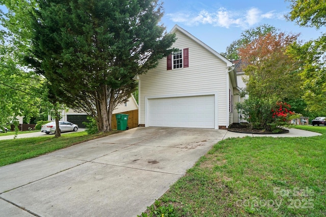 view of home's exterior with a lawn, an attached garage, and driveway