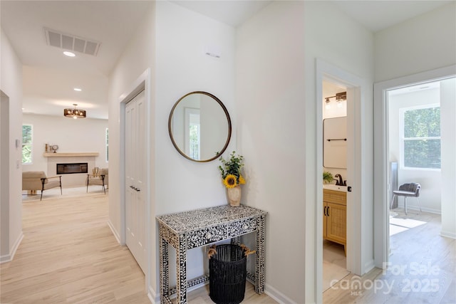 3300 Travis Ln NW, Concord, NC 28027 - hall with baseboards, recessed lighting, light wood-style flooring, and visible vents