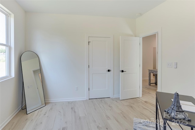 3300 Travis Ln NW, Concord, NC 28027 - bedroom featuring baseboards and light wood-style flooring