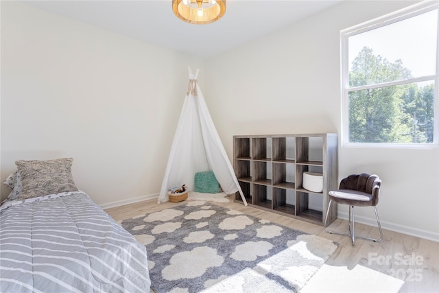 3300 Travis Ln NW, Concord, NC 28027 - bedroom featuring baseboards and wood finished floors