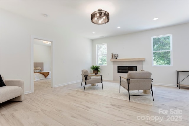3300 Travis Ln NW, Concord, NC 28027 - sitting room featuring a healthy amount of sunlight, baseboards, and light wood-type flooring
