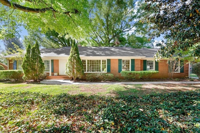 ranch-style house with brick siding